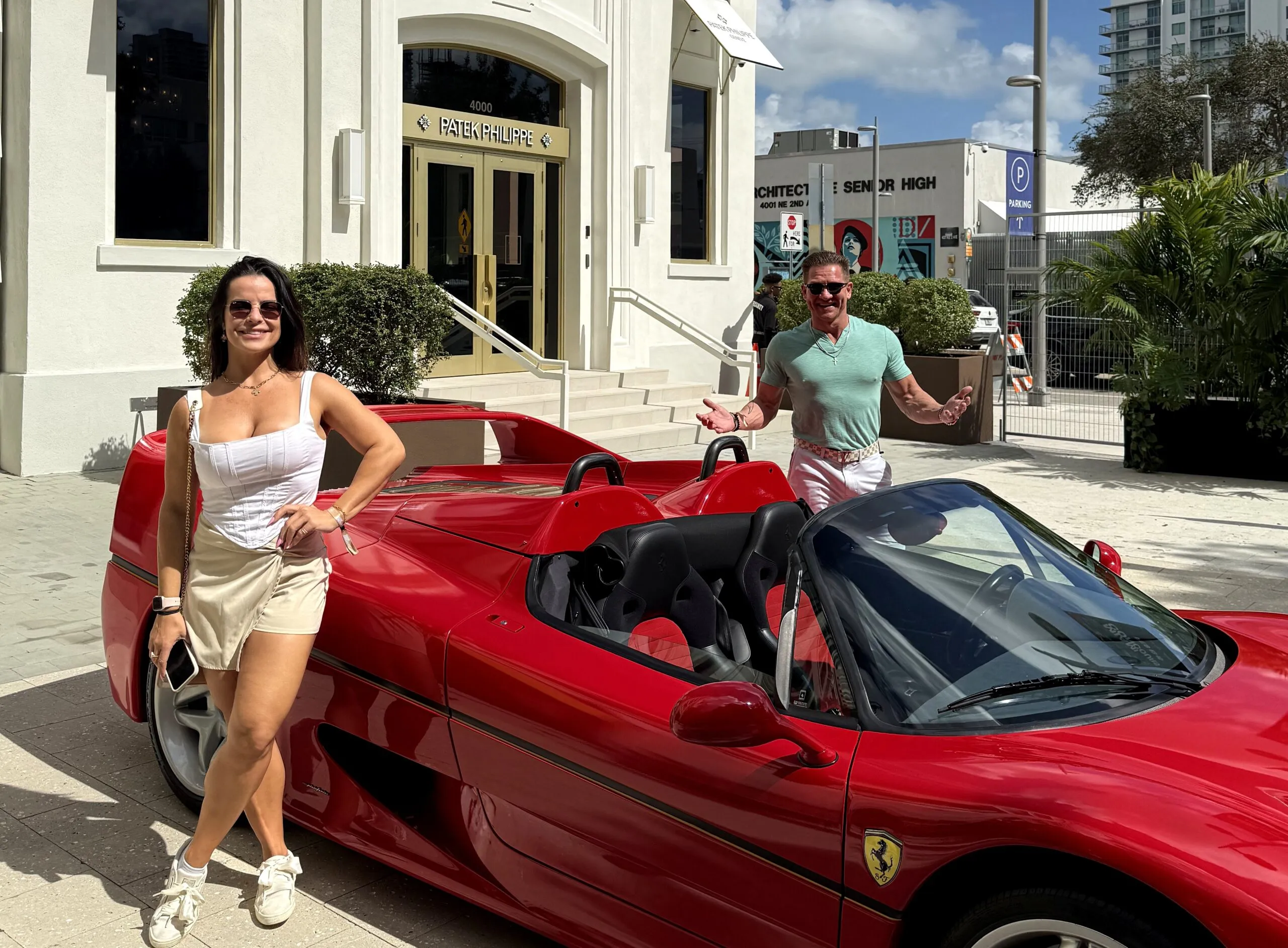 Heath Blanchard and Amanda Ferreira of Greauxx with a Ferrari